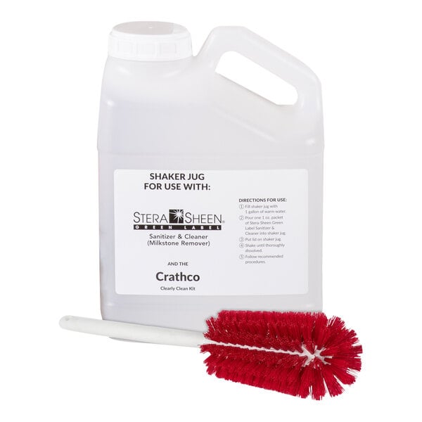 A white jug labeled "Clearly Clean" with a red brush inside.