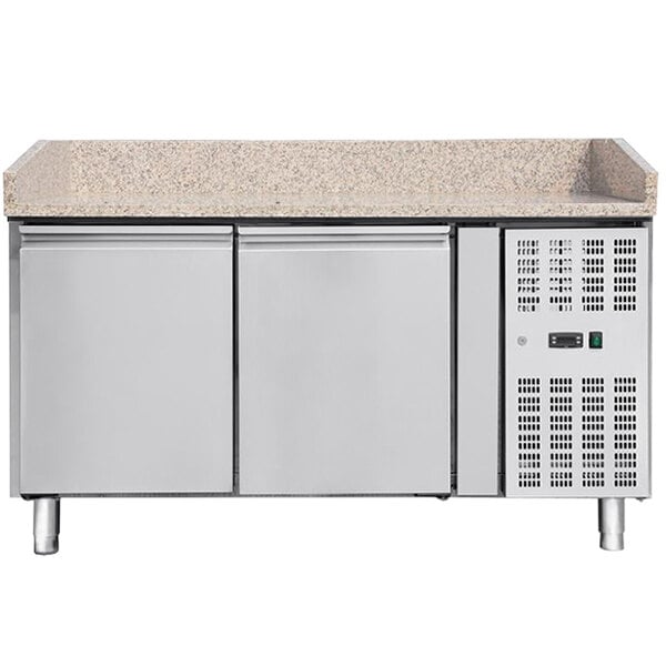 A white rectangular Omcan refrigerated pizza prep table with a granite top and two drawers.