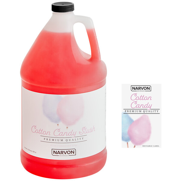 A red plastic jug of Narvon Cotton Candy slushy concentrate next to a jug of water.