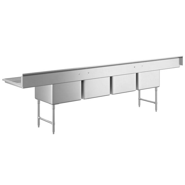 A Regency stainless steel four compartment commercial sink with two drainboards on a white background.