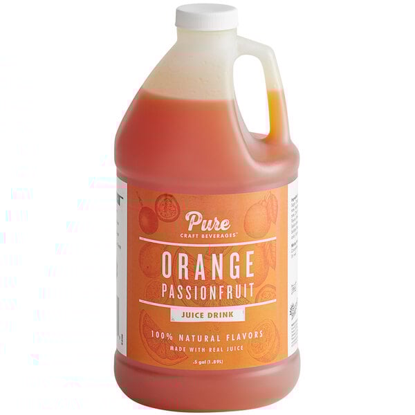 A white jug of Pure Craft Beverages Orange Passionfruit Beverage Concentrate on a table.