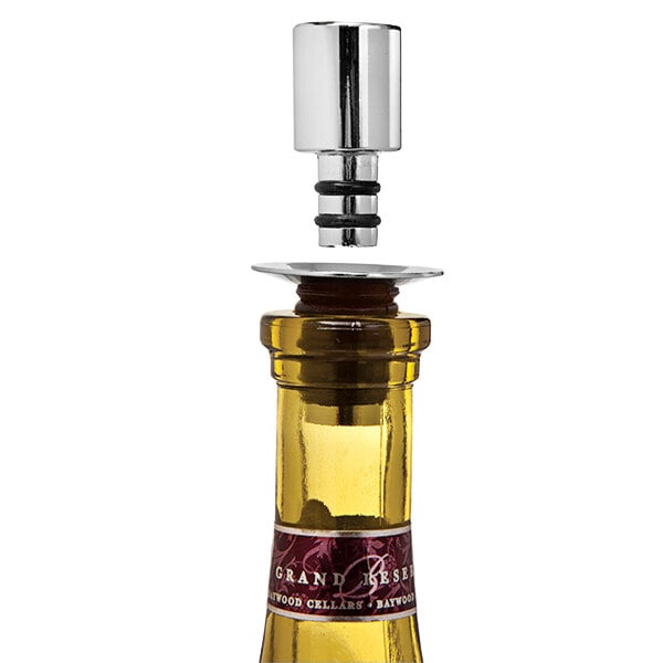 A Franmara Pour N' Seal bottle stopper and pourer in a wine bottle.