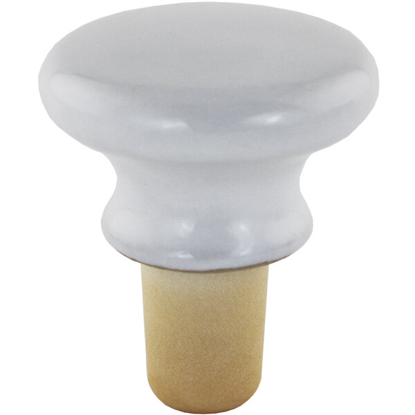 A Franmara porcelain bottle stopper with a wooden cap.