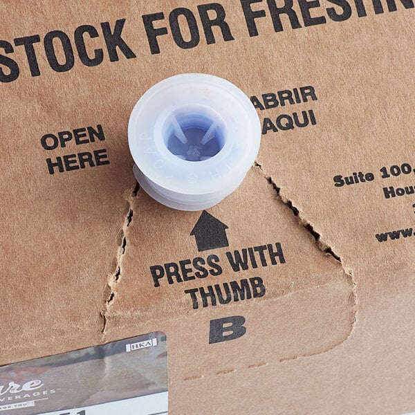 A close up of a Pure Craft Beverages bag in a box with a blue spool.