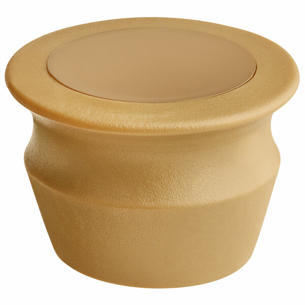 A Franmara gold wine stopper with a beige plastic seal.