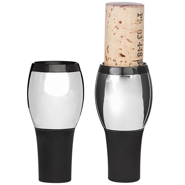 A Franmara cork stopper in a wine bottle with two glasses and a cork.