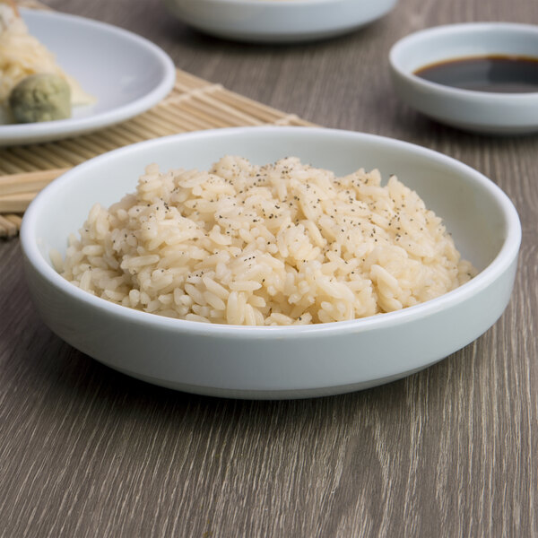 A bowl of rice with black pepper in a Blue Jade melamine bowl.