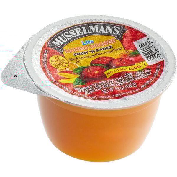 A close up of a Musselman's Lite Mango Orange Applesauce cup.