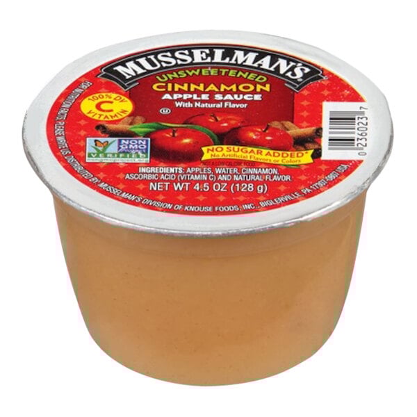 A container of Musselman's Cinnamon applesauce with a label.