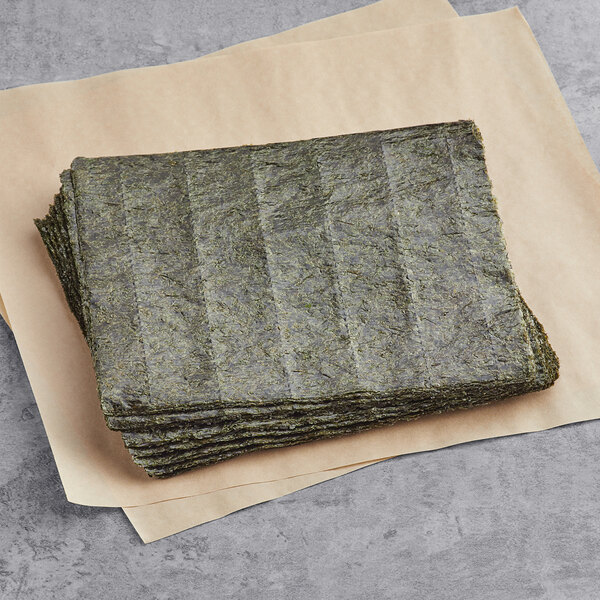 a stack of green sheets of seaweed