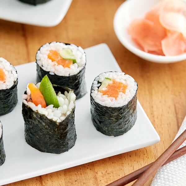 A plate of sushi rolls with Green Seaweed Sushi Nori.