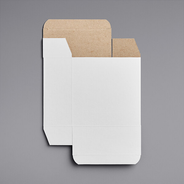 A white reverse tuck carton with a brown paper inside.
