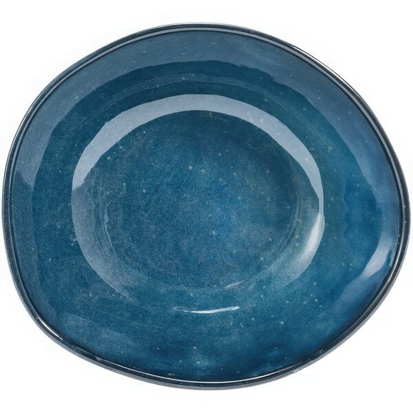 A blue bowl with a white speckled rim.