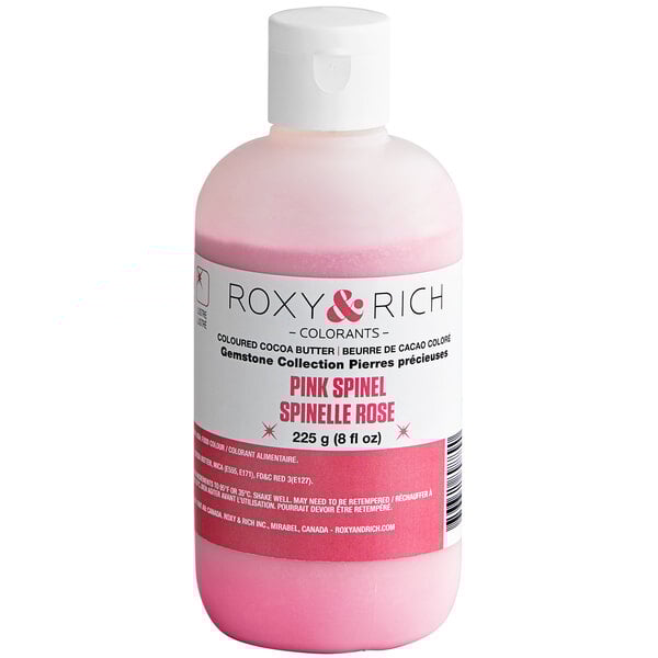 A close-up of a bottle of Roxy & Rich Pink Spinel cocoa butter with a pink liquid inside.