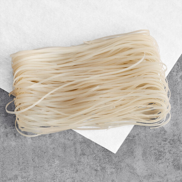 Rice Stick Noodles piled on a paper towel.