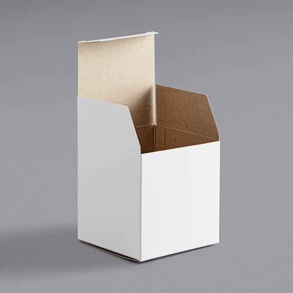 a white box with a brown lid