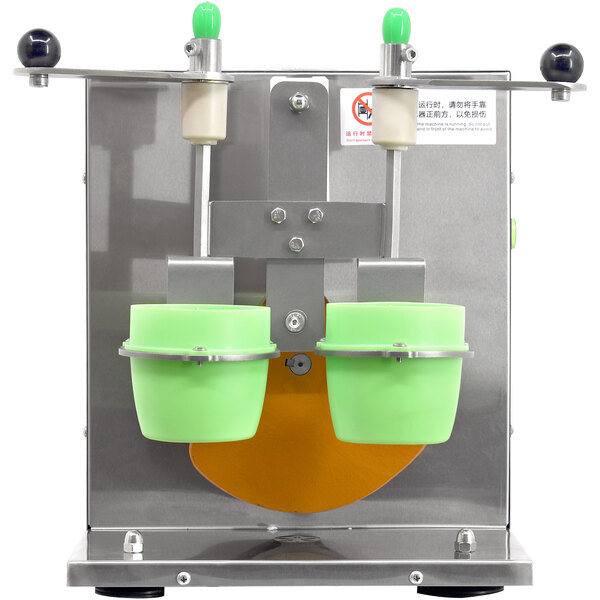 An Omcan drink shaking machine with double green cup holders.