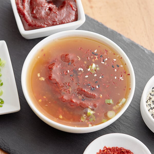 A white plate with red Hot Pepper Paste on it.