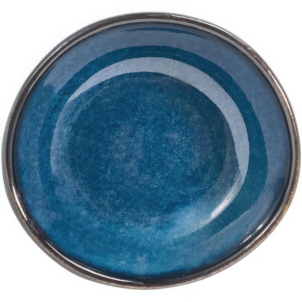 A small round indigo porcelain ramekin.