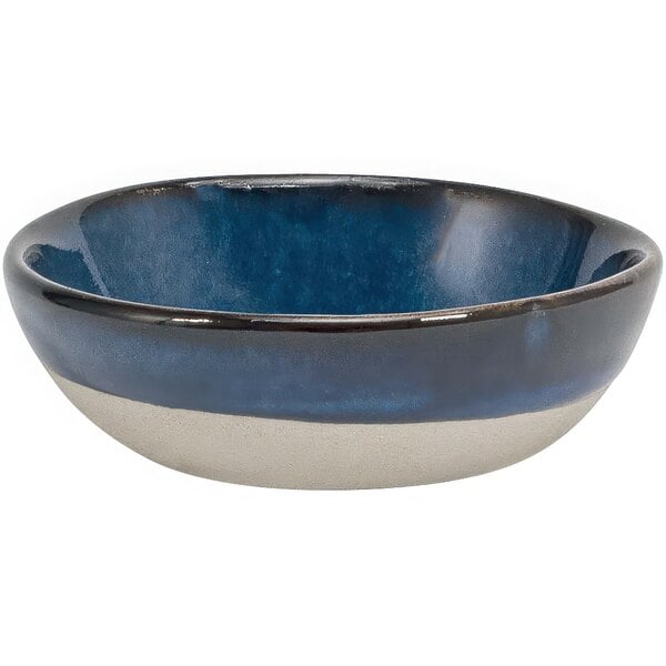 A small round indigo and white porcelain ramekin.