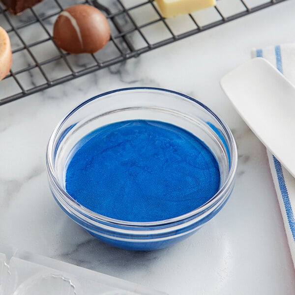 A bowl of Roxy & Rich Blue Lapis cocoa butter food coloring.