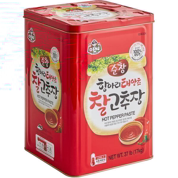 A red tin can of Wang Korean red pepper paste with a white label.