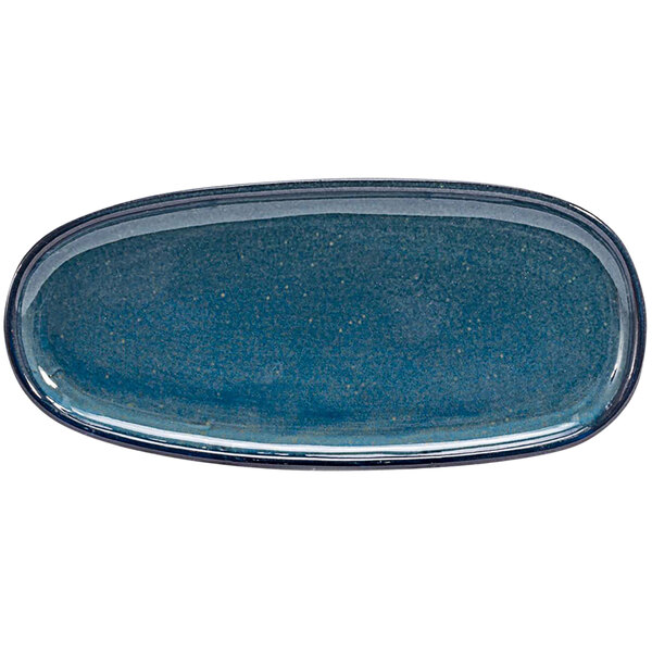A close-up of a blue Front of the House Artefact oval porcelain plate with a black rim.