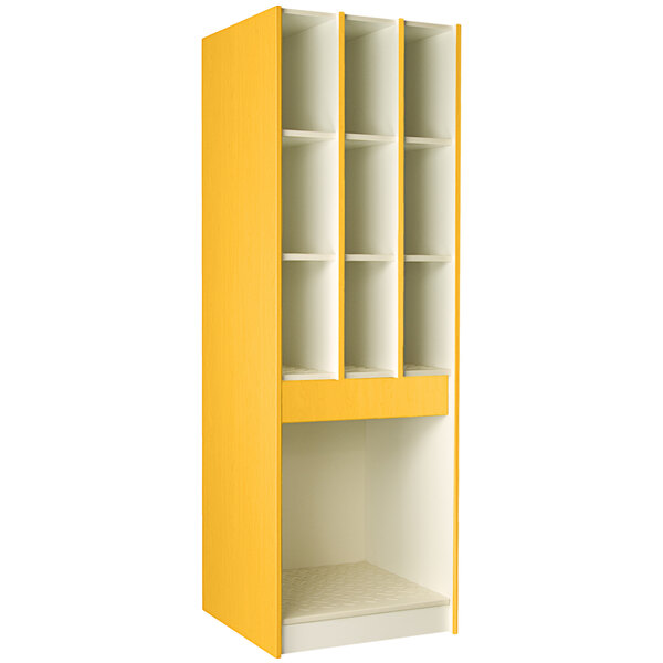 A yellow I.D. Systems instrument storage cabinet with shelves of varying sizes.