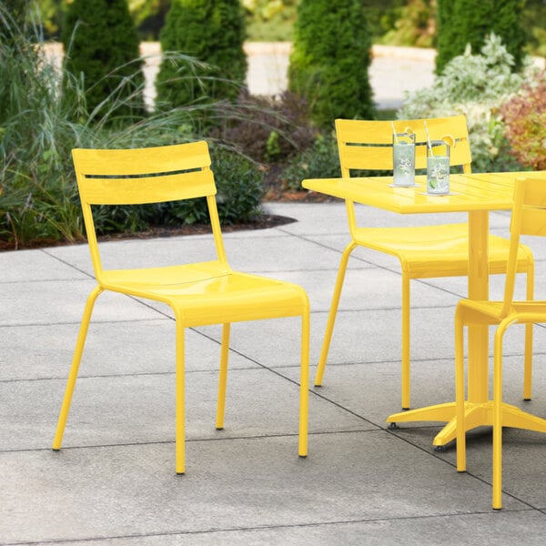 a yellow chair and table on a patio