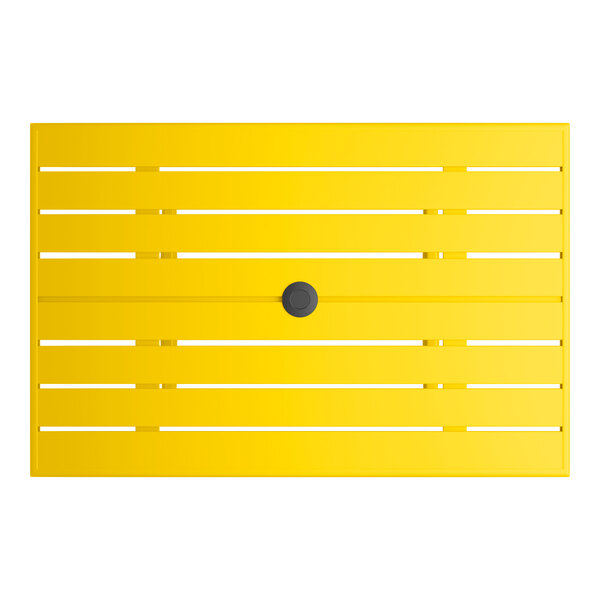 A rectangular yellow powder-coated aluminum outdoor dining table with slatted design and an umbrella hole in the center.