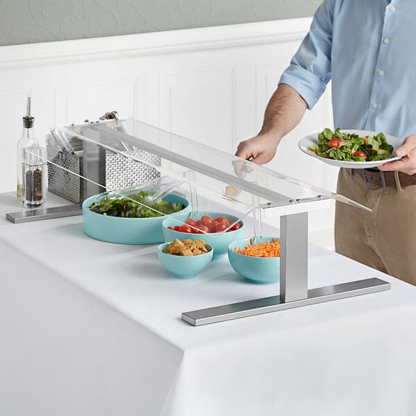 a salad bar with bowls of food