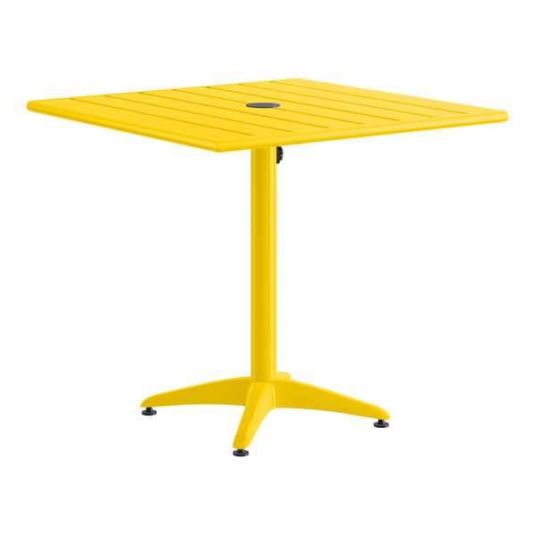 A yellow, square, powder-coated aluminum outdoor dining table with an umbrella hole in the center.