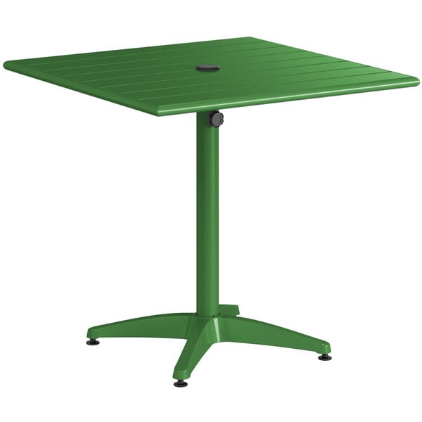 A green table with a black base.
