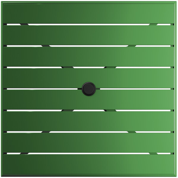 A green square table with a black circle on the surface.