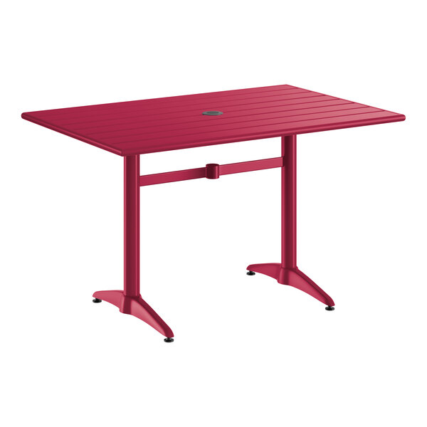 A rectangular sangria-colored aluminum outdoor dining table with an umbrella hole in the center.