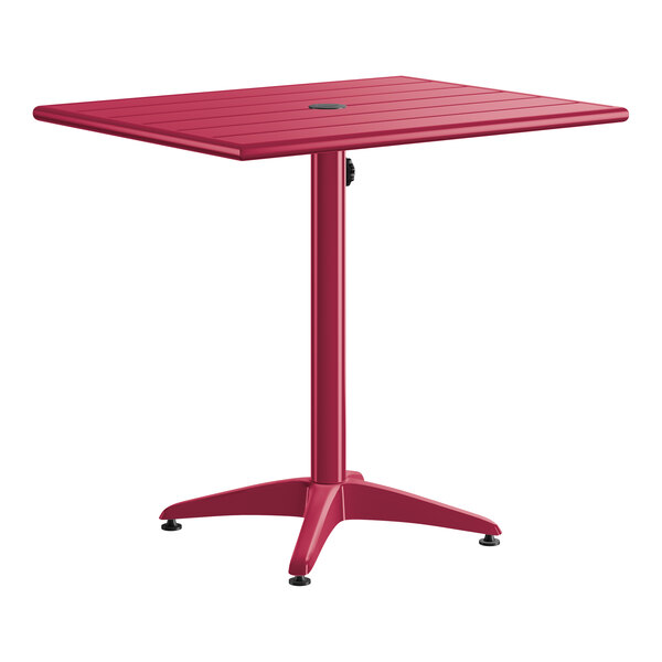 A rectangular sangria-colored aluminum outdoor dining table with an umbrella hole and a four-legged base.
