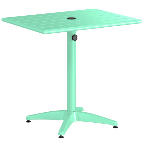 A seafoam green Lancaster Table & Seating dining table with a black circle on top.