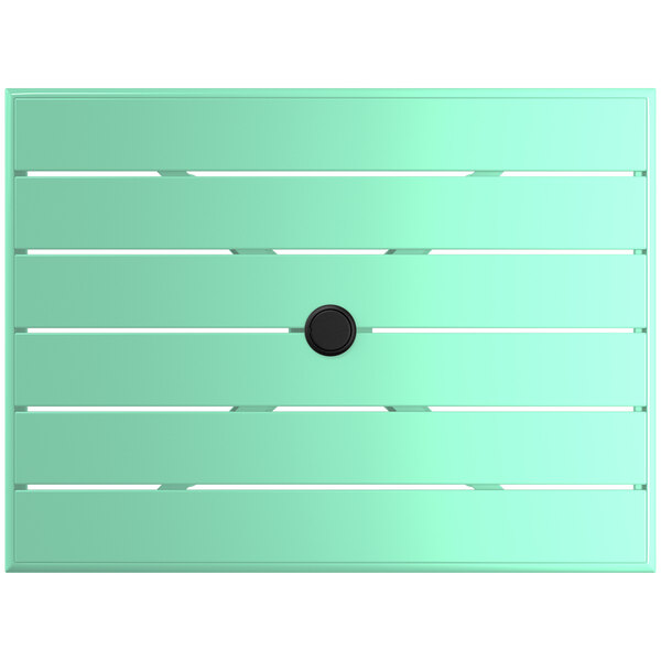 A seafoam green rectangular table with a black circle in the middle.