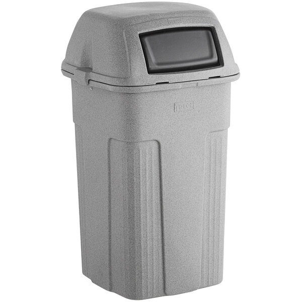A gray Toter trash can with a black lid.