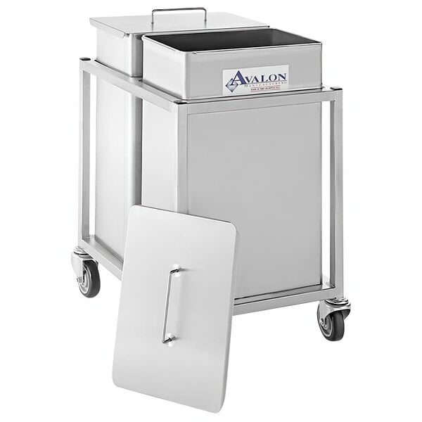 A white rectangular stainless steel container with a metal lid on a cart.