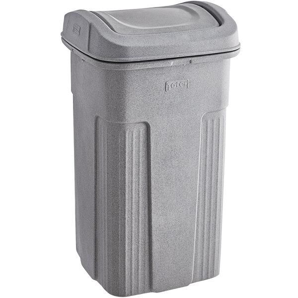 A Toter gray plastic trash can with a square lid.
