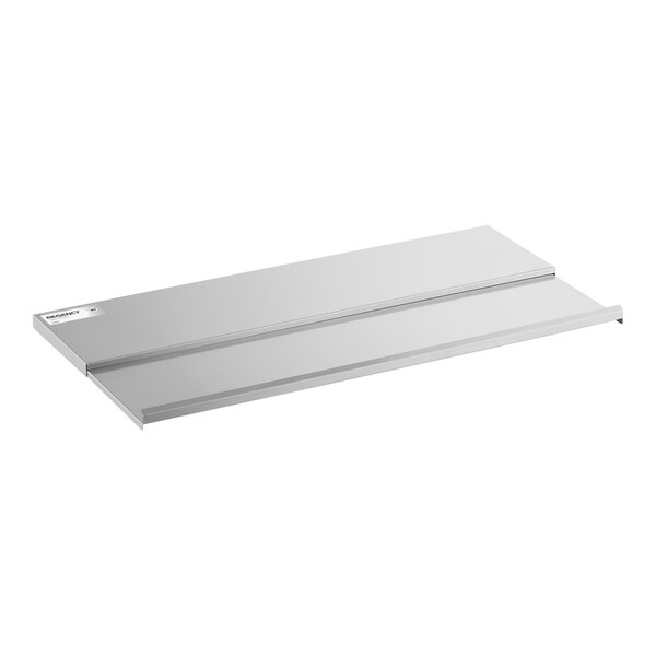 A rectangular, flat, metallic sliding lid with a small label in the corner, designed to fit over a bin or container.