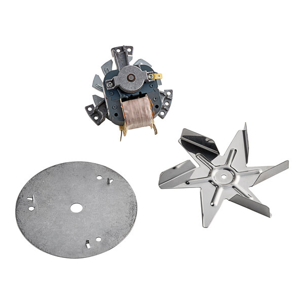 A metal fan blade with a hole in it attached to a circular metal plate.