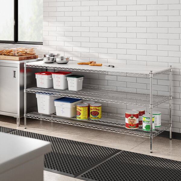 A Regency chrome metal shelf in a kitchen with food containers on it.