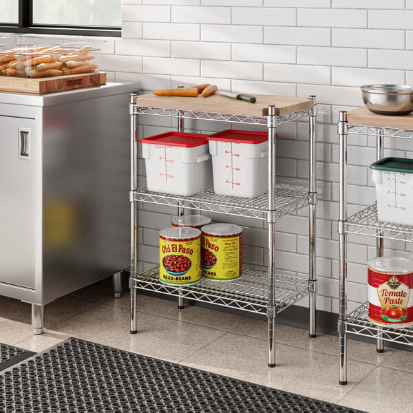 Regency chrome metal shelving with a wooden shelf holding food items.