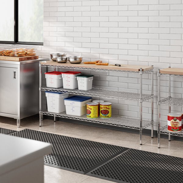 A Regency chrome shelving kit with a wooden shelf on a kitchen counter.