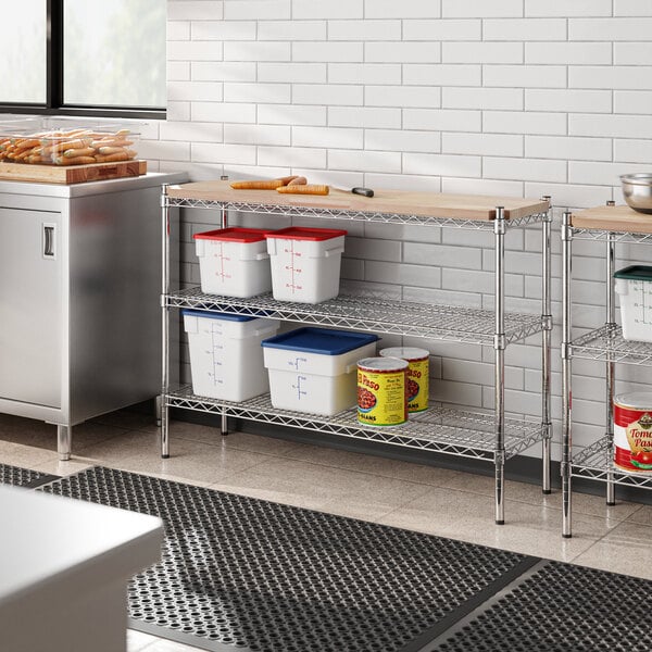 A Regency chrome shelving unit in a kitchen with food items on wooden shelves.