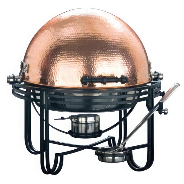 An American Metalcraft round chafing dish with a hammered copper cover on a black stand.