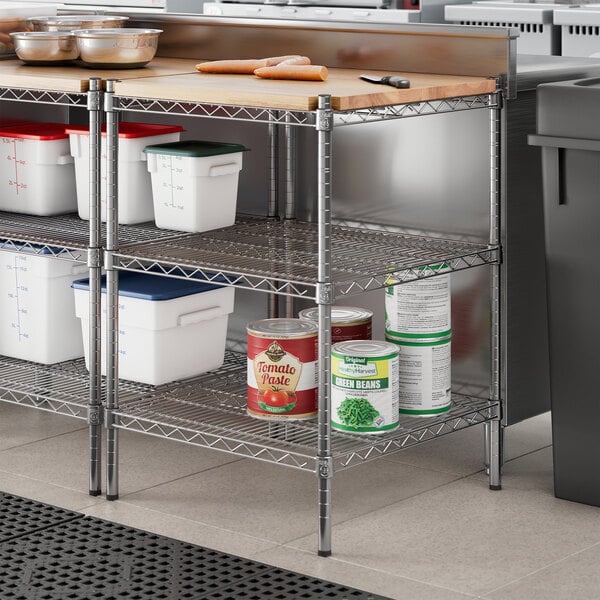 A Regency chrome metal shelf kit with wooden shelves holding white plastic containers.