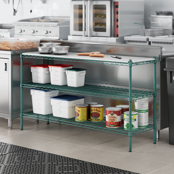 A Regency metal shelf with removable plastic shelves holding food containers and cans on a white counter.